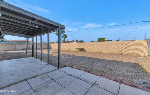 a view of a backyard of the house