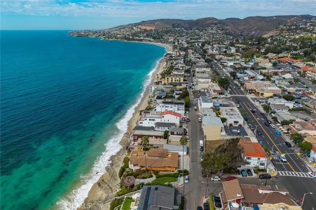 an aerial view of residential building and lake