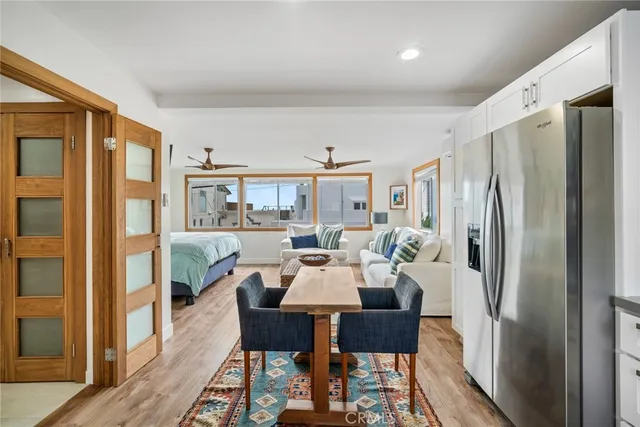 a view of a dining room with furniture window and wooden floor
