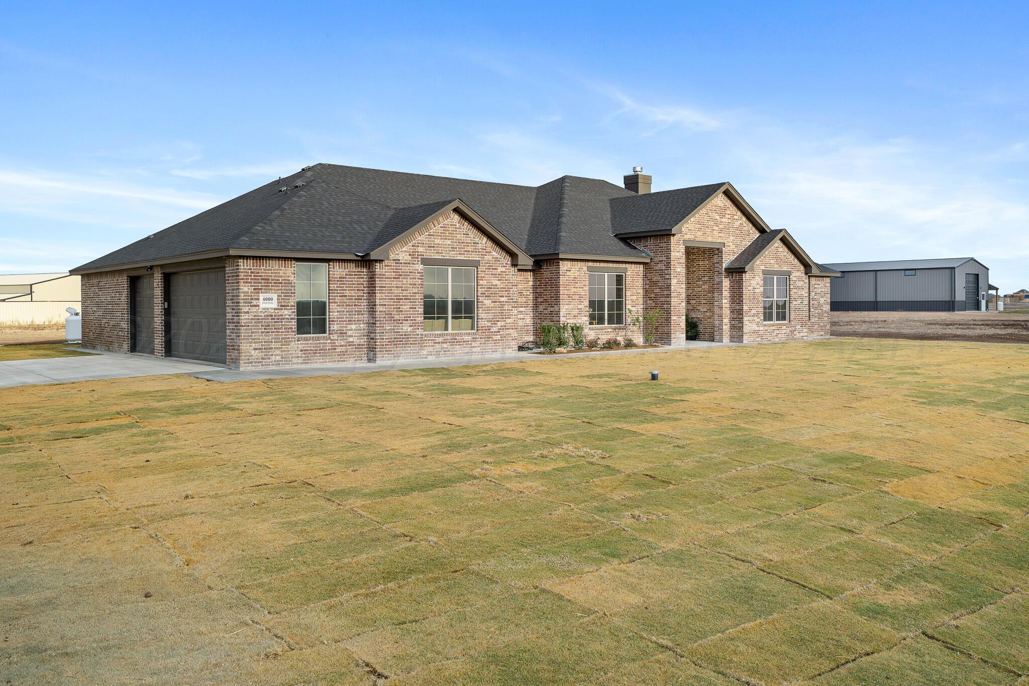 a front view of a house with yard