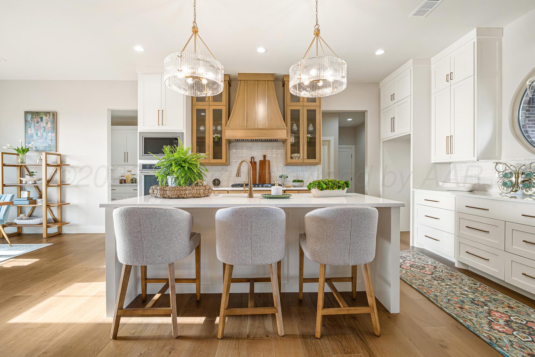 4000 Juniper Springs Road Amarillo, TX 79119 - Photo 13 of 40 a dining room filled chandelier and kitchen view