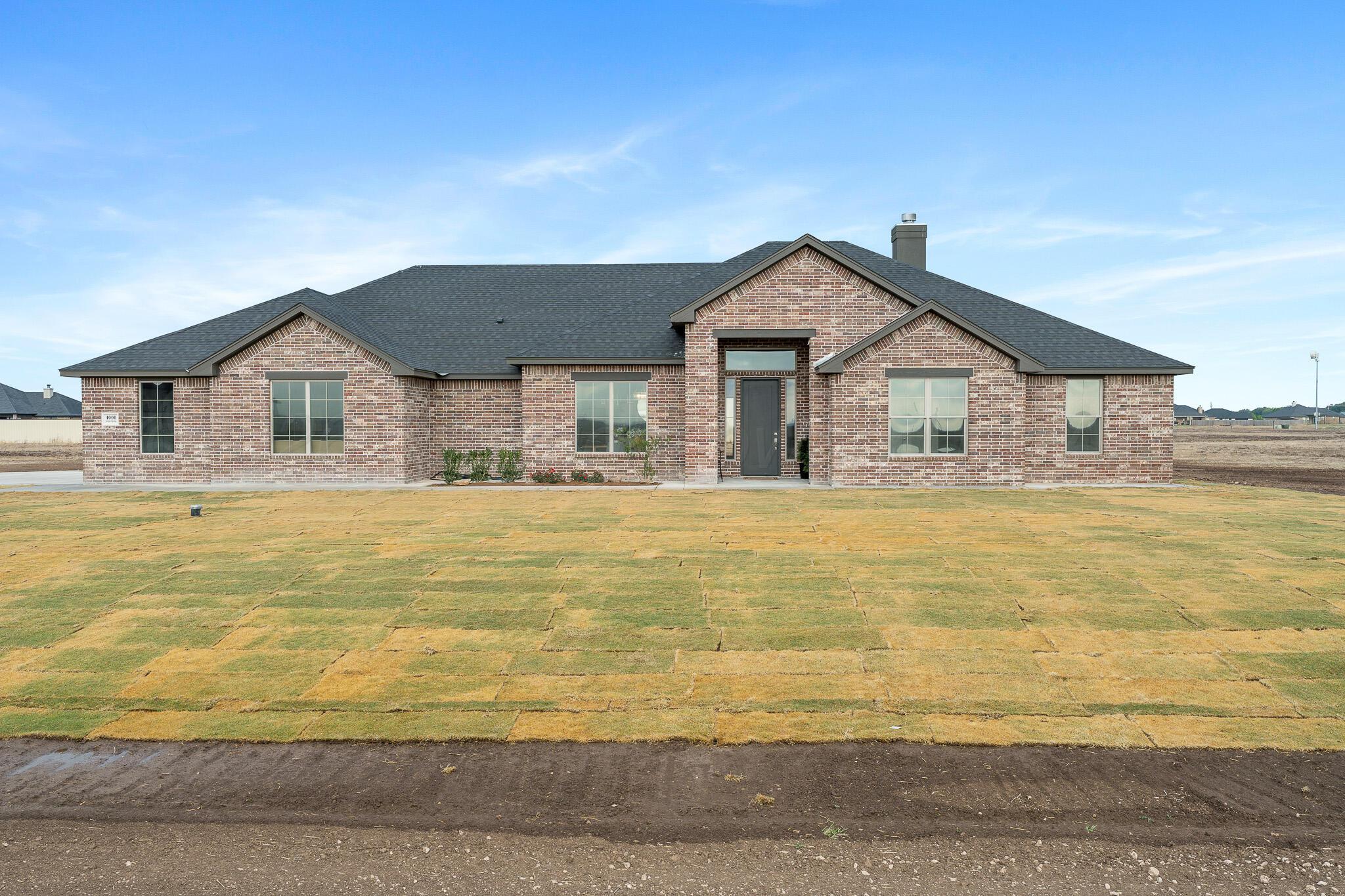 4000 Juniper Springs Road Amarillo, TX 79119 - Photo 2 of 40 a front view of a house with a swimming pool