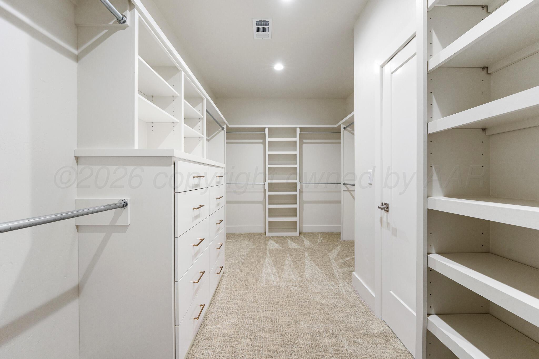 4000 Juniper Springs Road Amarillo, TX 79119 - Photo 29 of 40 a view of walk in closet with empty racks