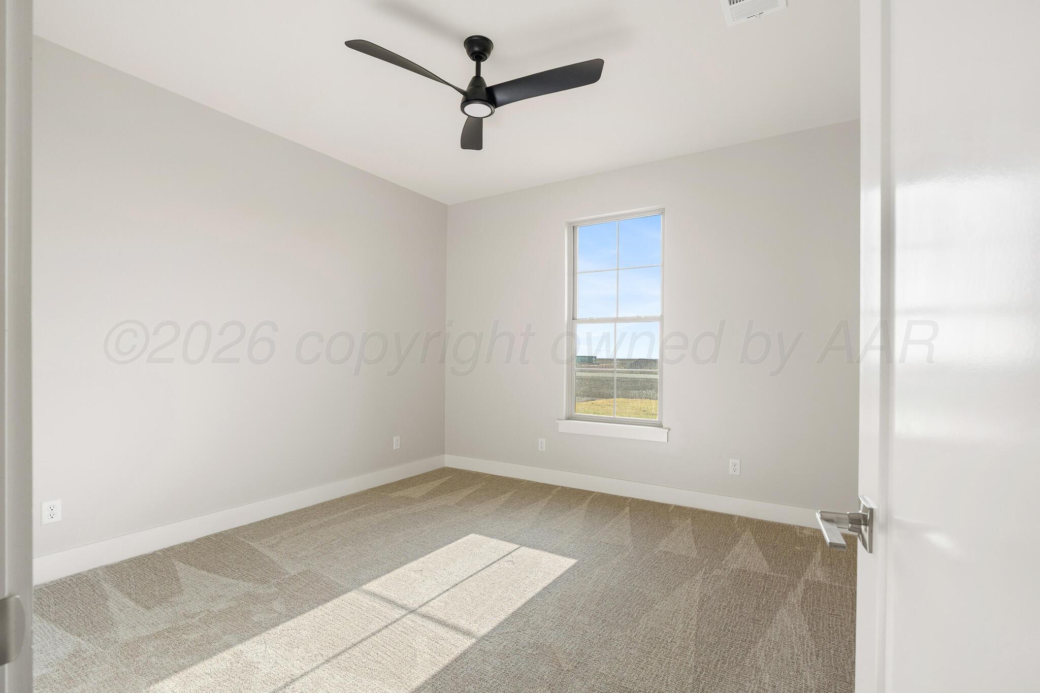 4000 Juniper Springs Road Amarillo, TX 79119 - Photo 30 of 40 wooden floor in an empty room with a window