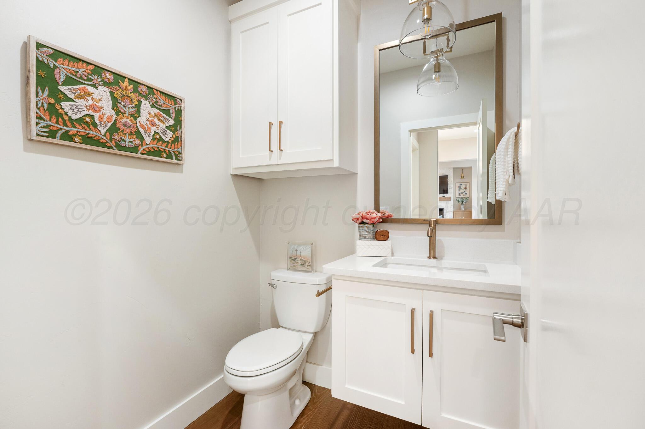 4000 Juniper Springs Road Amarillo, TX 79119 - Photo 31 of 40 a bathroom with a toilet sink and mirror