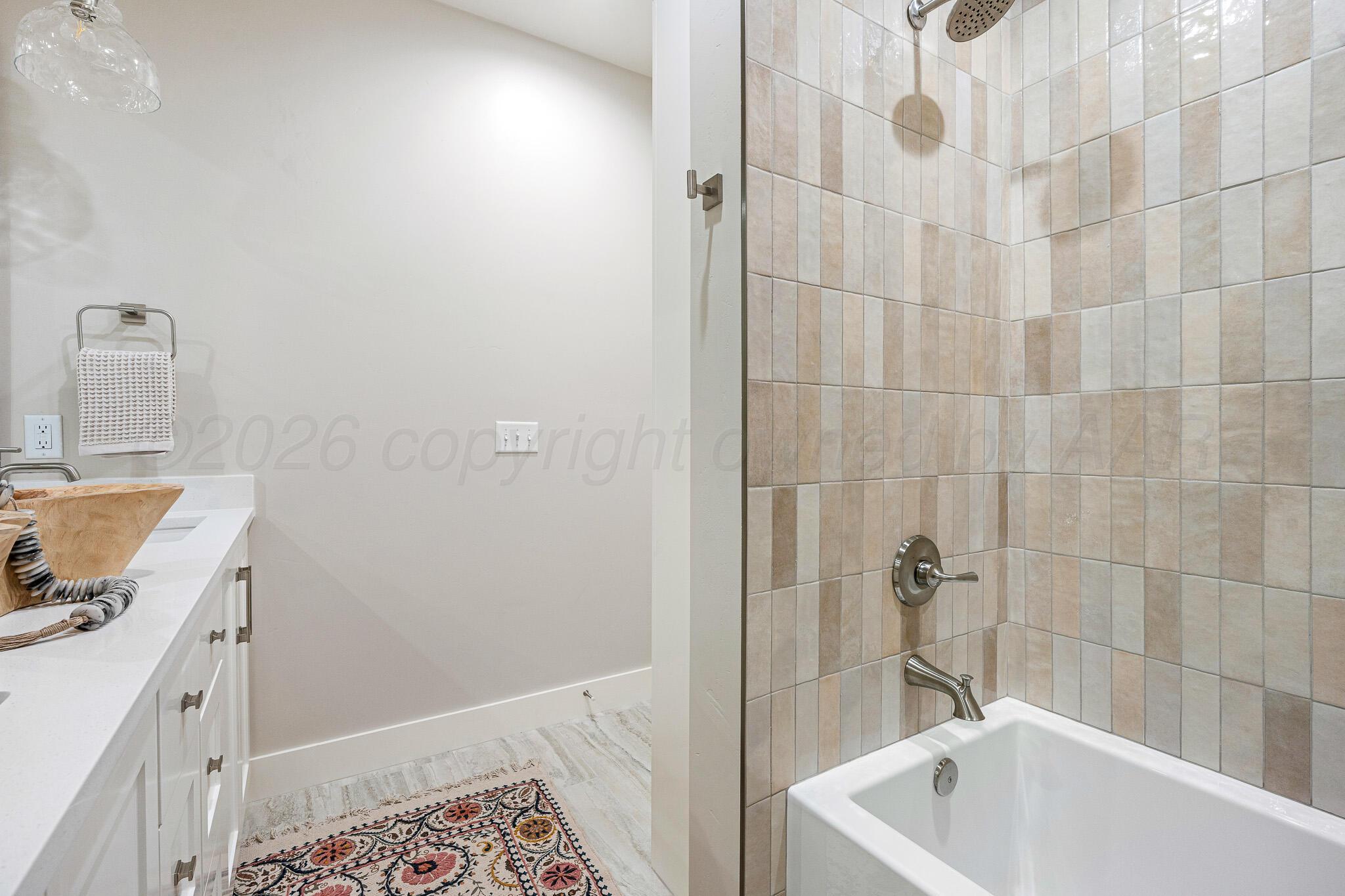 4000 Juniper Springs Road Amarillo, TX 79119 - Photo 35 of 40 a bathroom with a sink a toilet and shower
