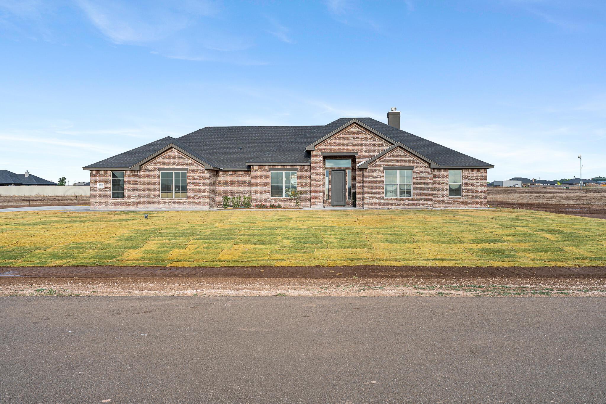 4000 Juniper Springs Road Amarillo, TX 79119 - Photo 40 of 40 a view of a house with a big yard and a large tree