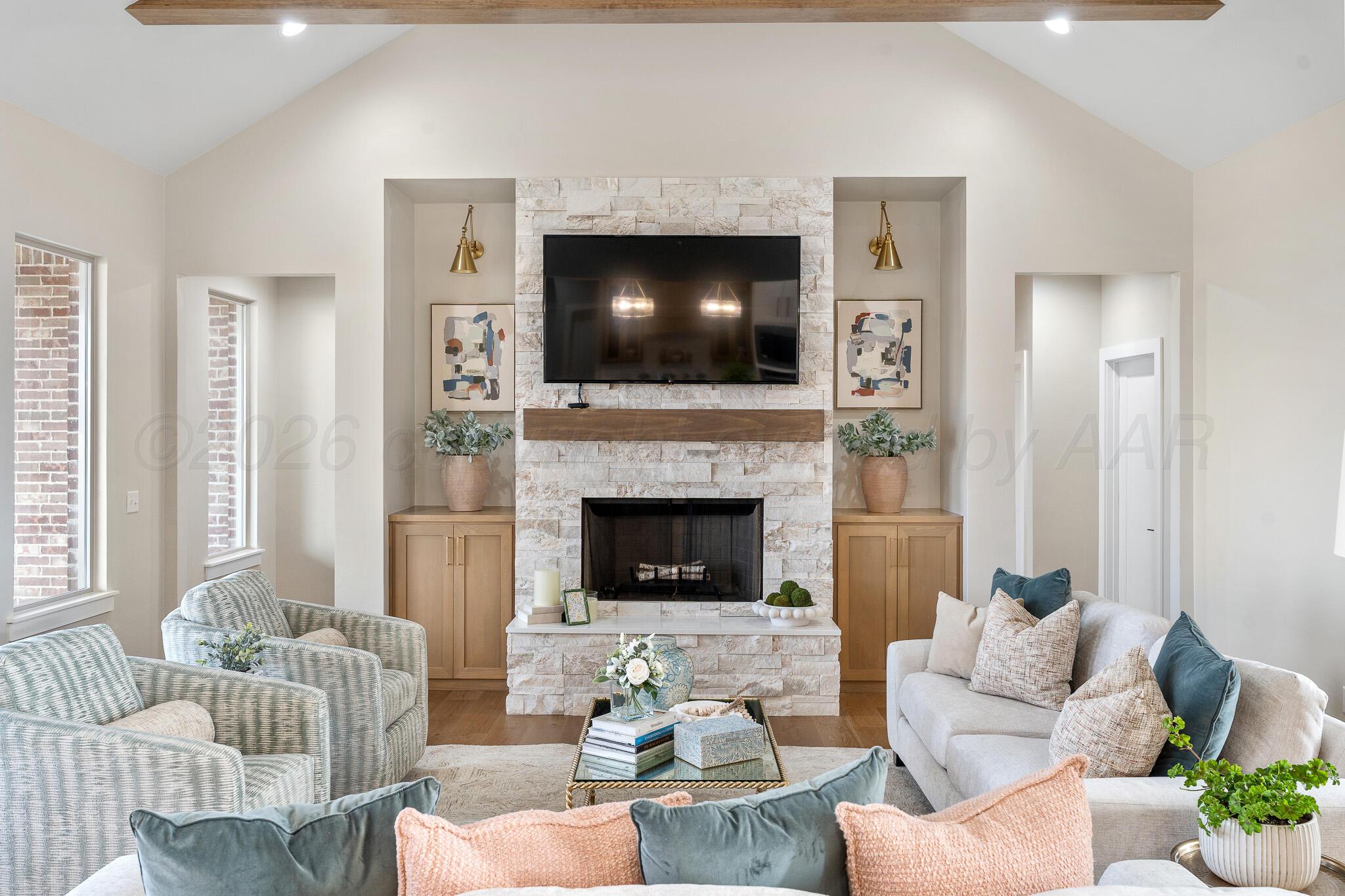 4000 Juniper Springs Road Amarillo, TX 79119 - Photo 8 of 40 a living room with furniture and a fireplace