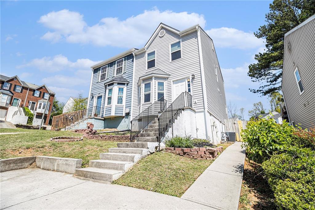 a front view of a house with garden
