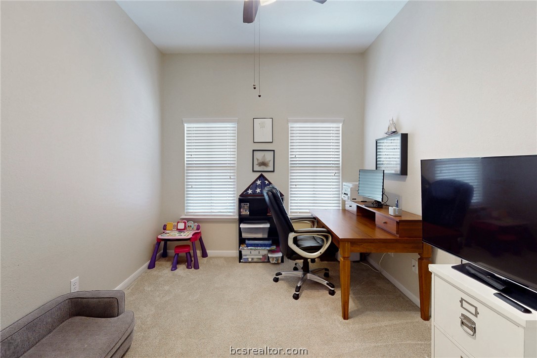 2071 Positano Loop Bryan, TX 77808 - Photo 19 of 31 a room with furniture and gym equipment