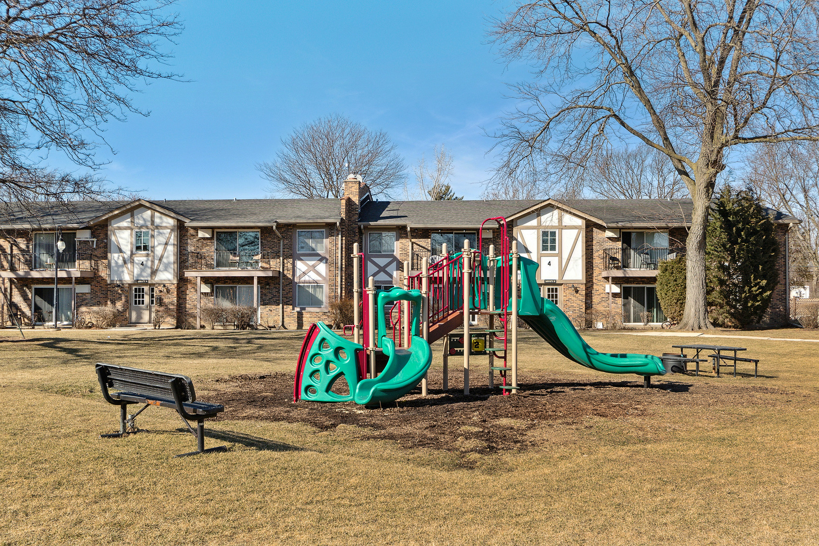 9-s120 Lake Drive, Unit 201 Willowbrook, IL 60527 - Photo 17 of 17 a view of a bedroom with a table and chairs