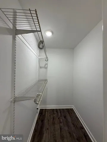 a view of storage and utility room with empty racks