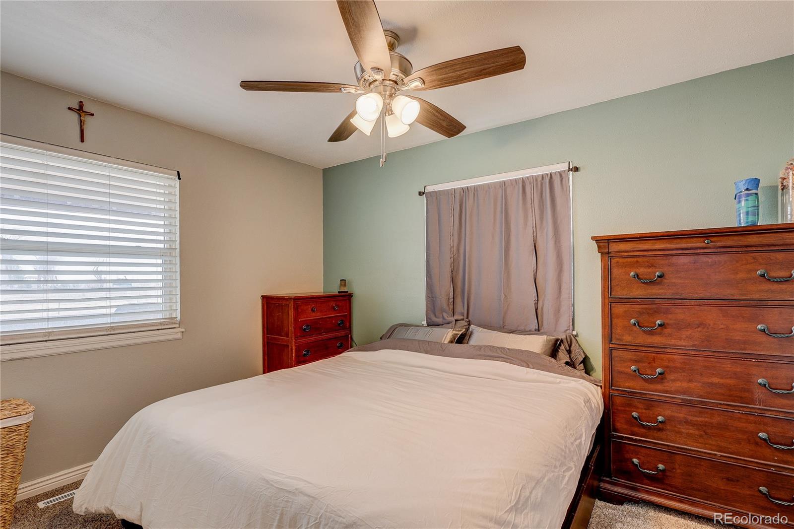 313 Front Street Roggen, CO 80652 - Photo 15 of 49 a bedroom with a bed and a dresser