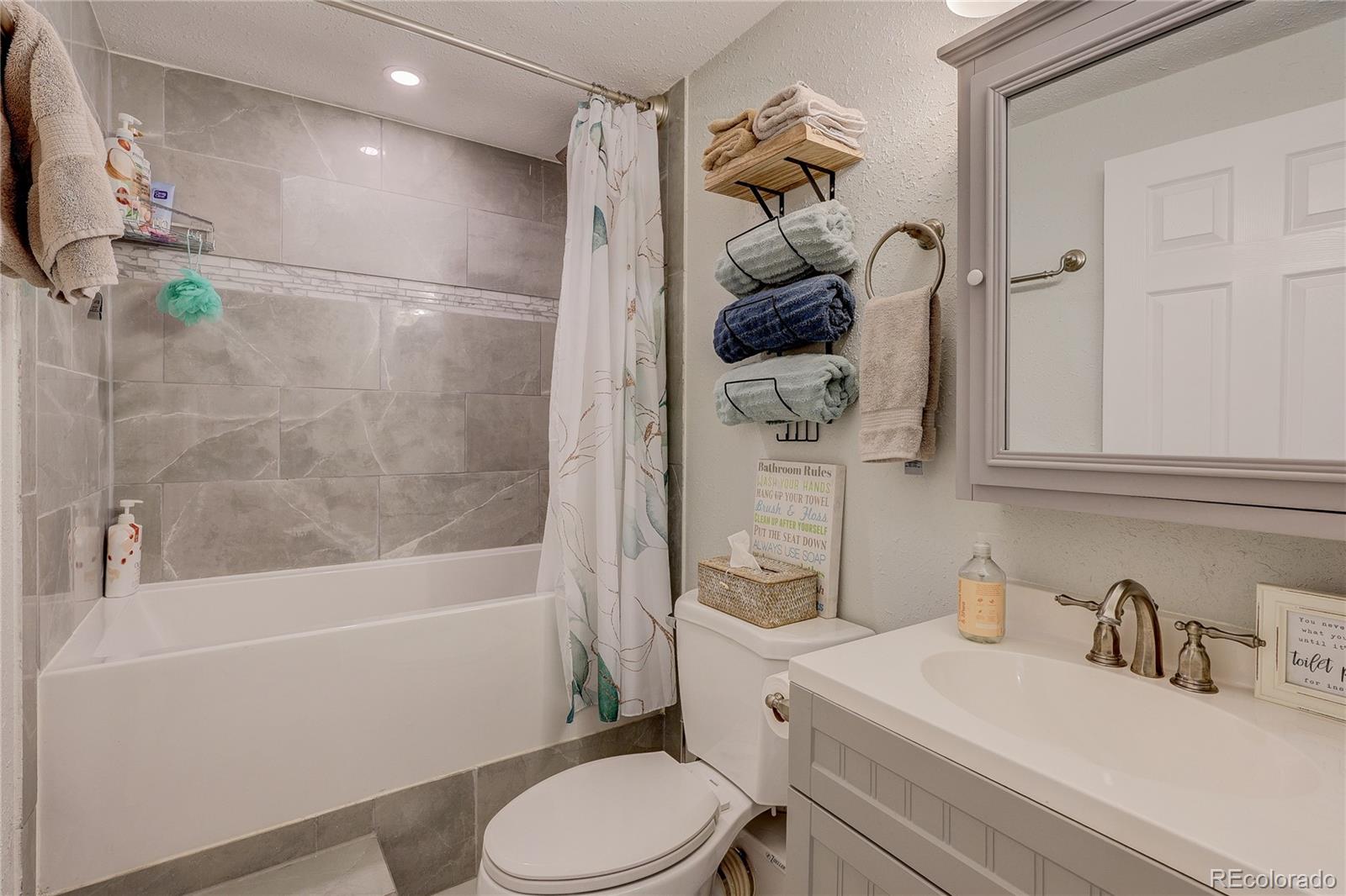 313 Front Street Roggen, CO 80652 - Photo 24 of 49 a bathroom with a sink toilet and shower