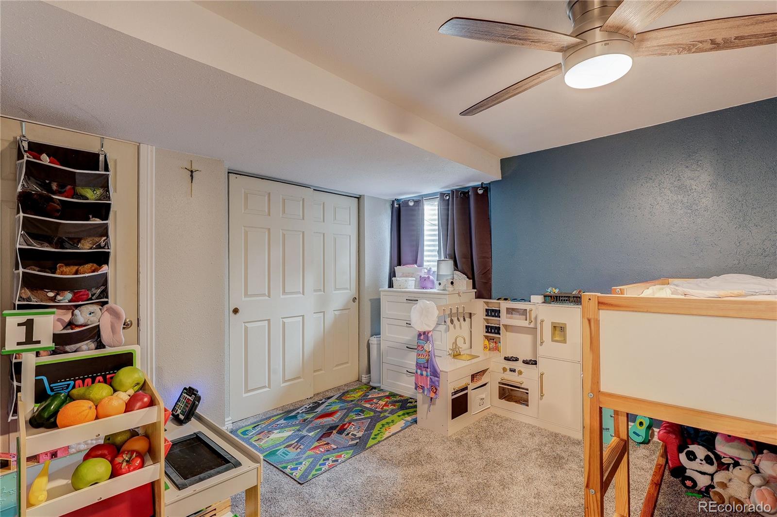 313 Front Street Roggen, CO 80652 - Photo 27 of 49 a view of kids room with toys