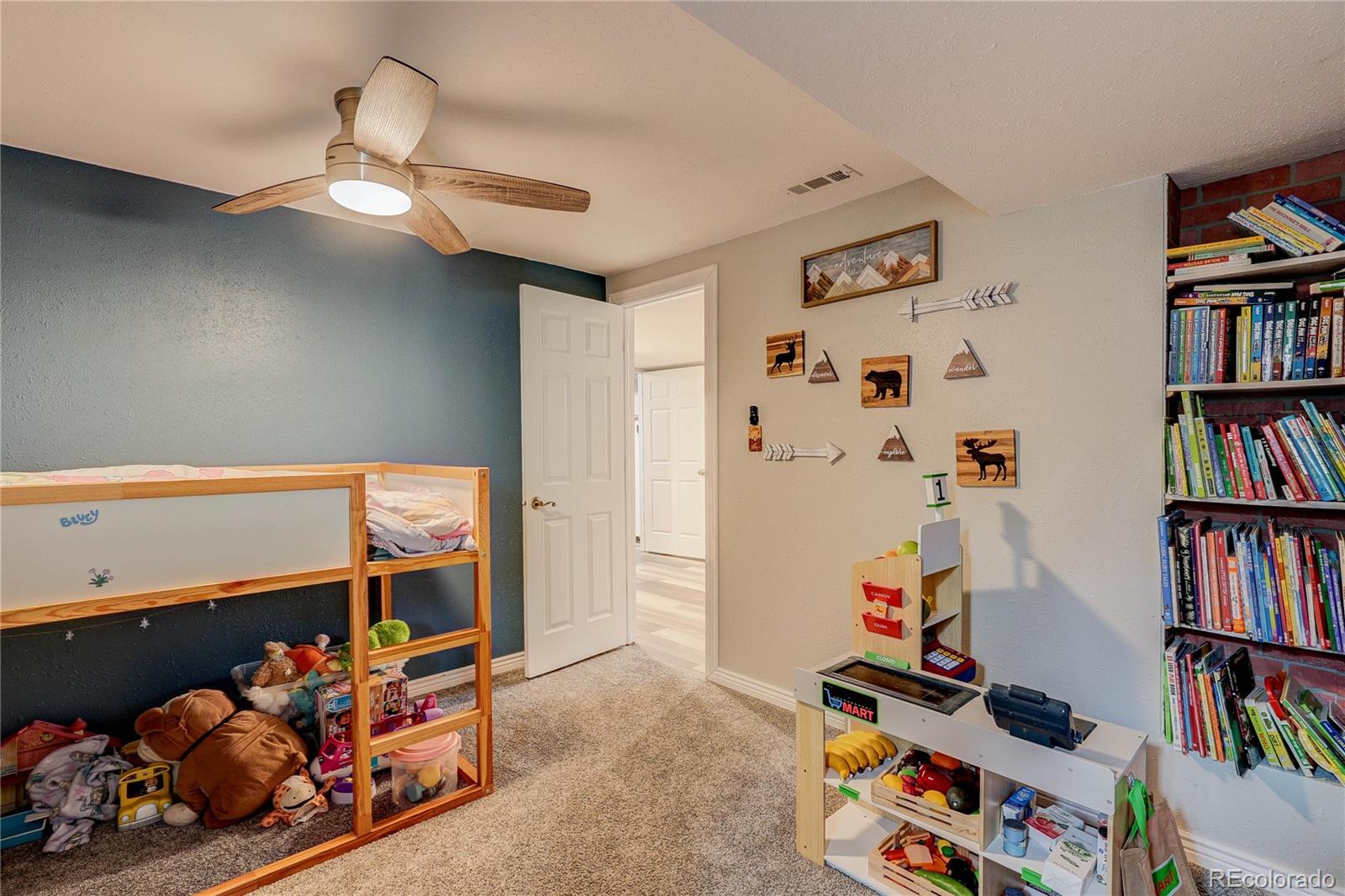 313 Front Street Roggen, CO 80652 - Photo 28 of 49 a room with toys and a potted plant
