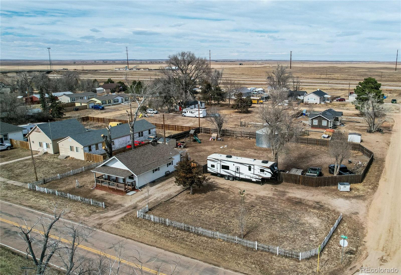 313 Front Street Roggen, CO 80652 - Photo 33 of 49 an aerial view of a parking space and parking