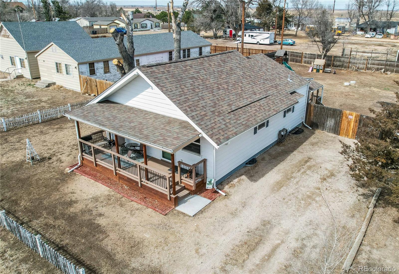 313 Front Street Roggen, CO 80652 - Photo 39 of 49 a aerial view of a house with a yard and sitting space