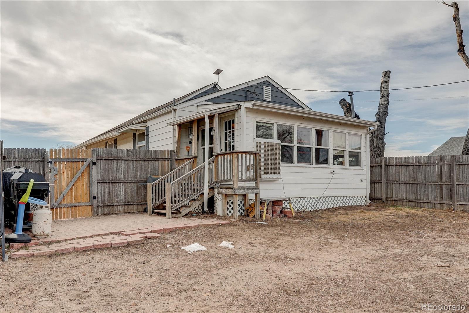 313 Front Street Roggen, CO 80652 - Photo 44 of 49 a view of a house with wooden fence
