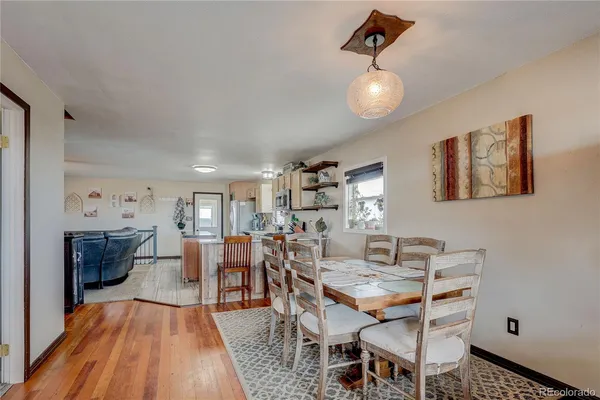 a view of a dining room with furniture