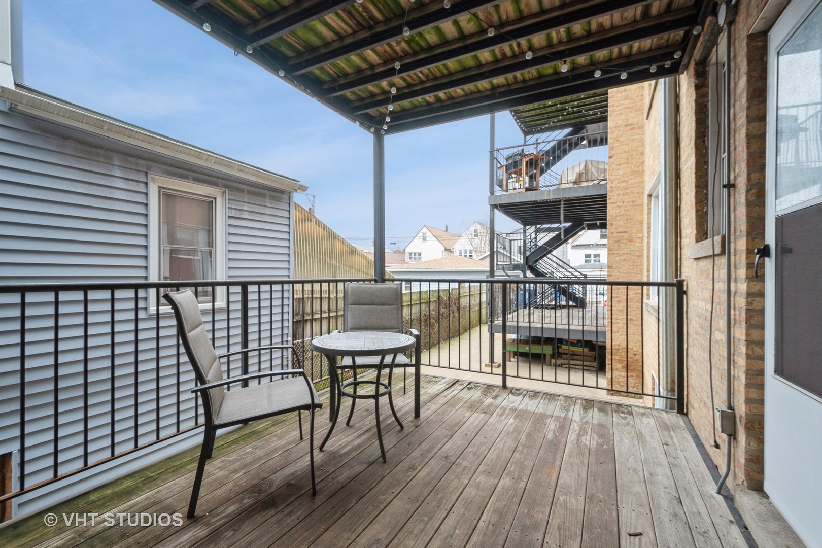 3337 West Byron Street, Unit 1 Chicago, IL 60618 - Photo 11 of 12 a balcony view with a seating space