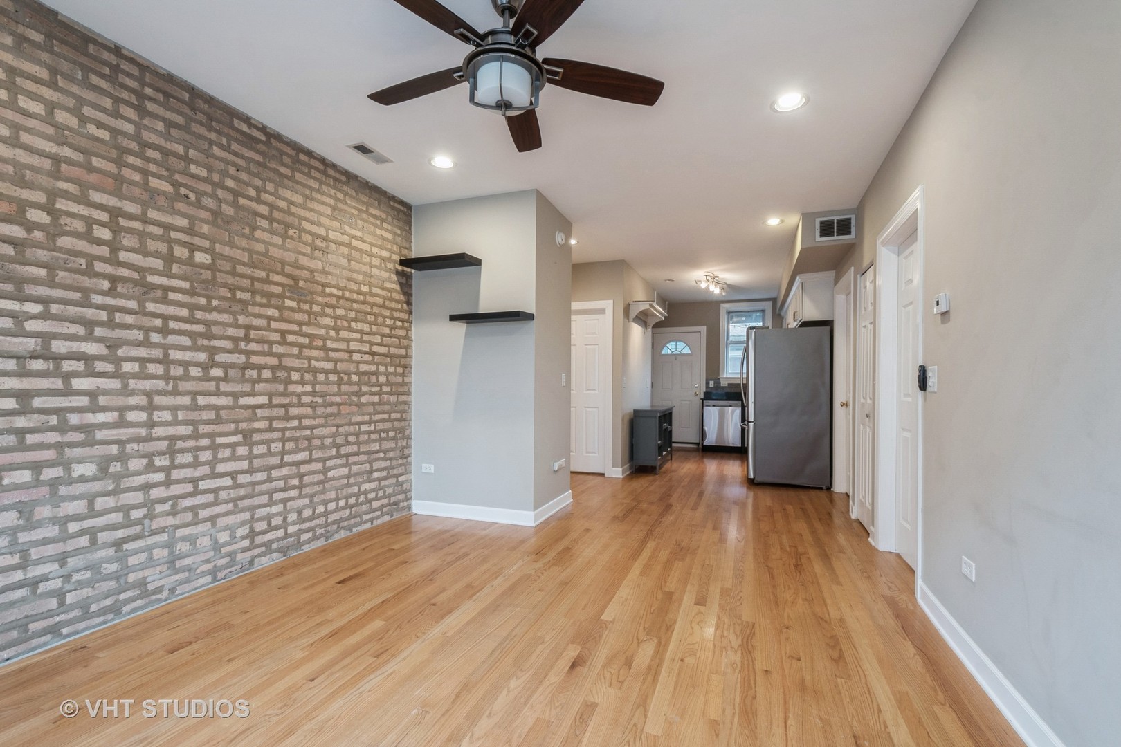 3337 West Byron Street, Unit 1 Chicago, IL 60618 - Photo 2 of 12 a view of a hallway with wooden floor