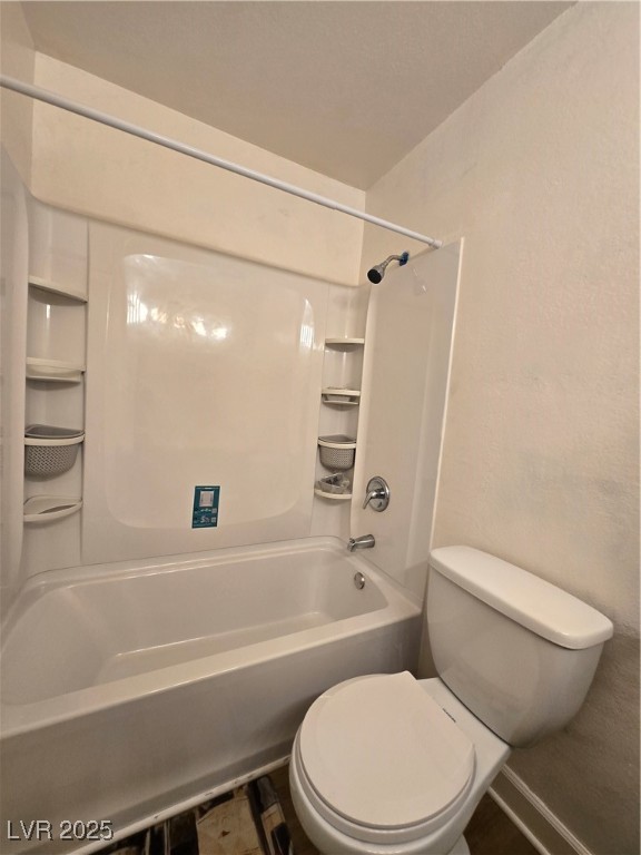 4440 Rich Drive, Unit C Las Vegas, NV 89102 - Photo 14 of 15 Full bath featuring shower combination and a textured wall