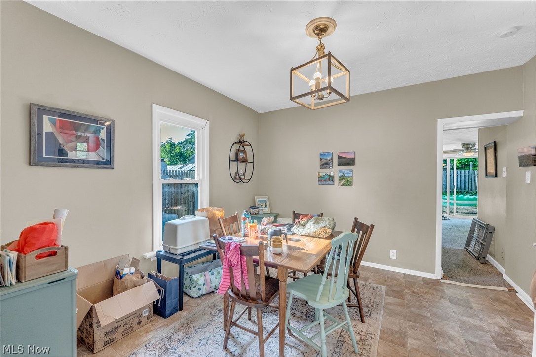 422 West Smith Road Medina, OH 44256 - Photo 11 of 29 Dining area featuring warm neutral wall tones and wood-finish flooring