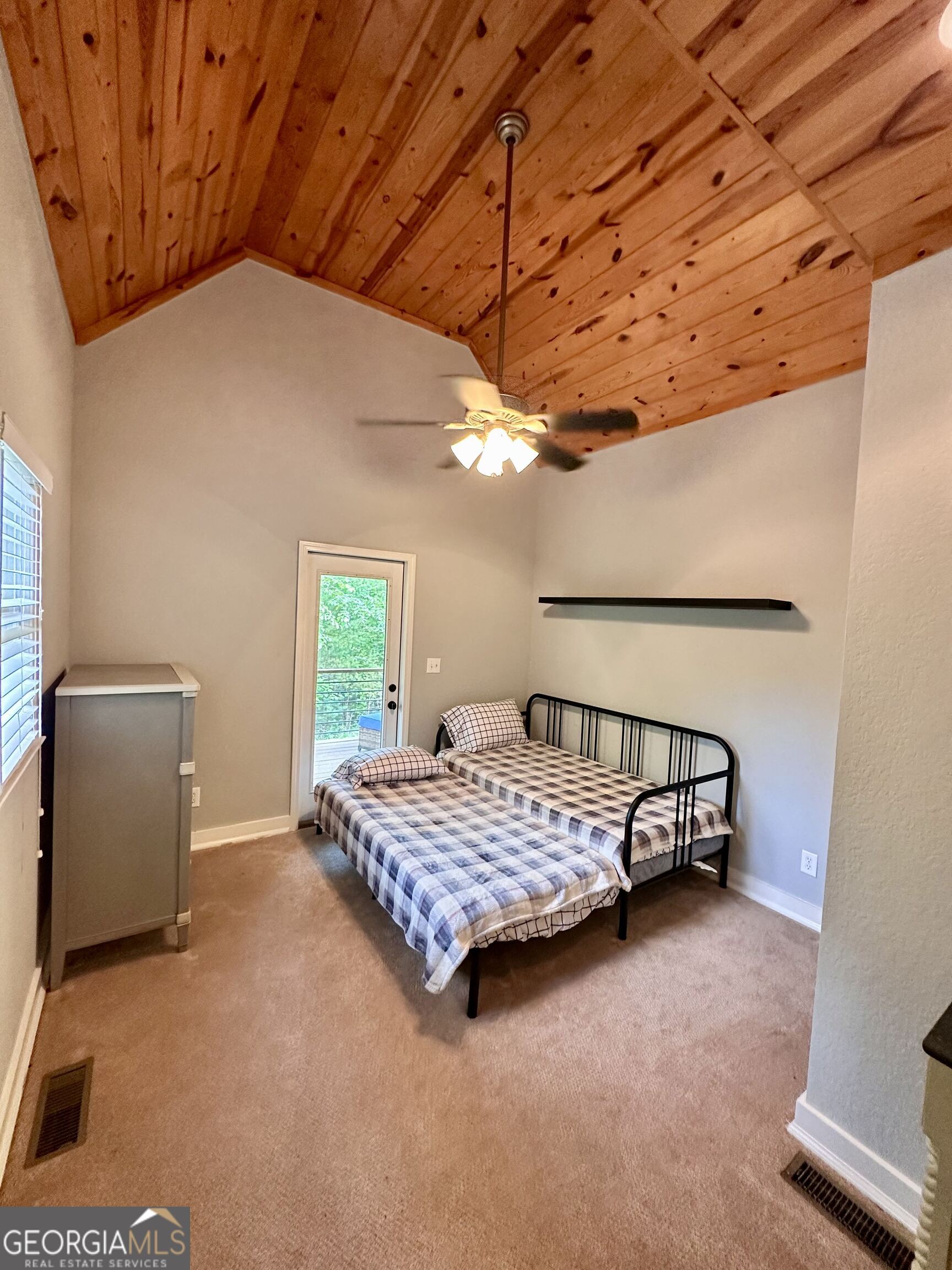 2769 Bean Creek Road Sautee Nacoochee, GA 30571 - Photo 17 of 33 a room with a bed and a window