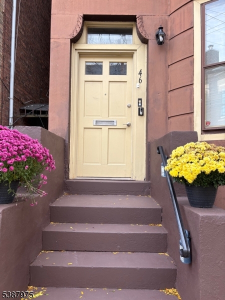 46 James Street, Unit 2 Newark, NJ 07102 - Photo 1 of 12 a vase of flowers sitting on a floor