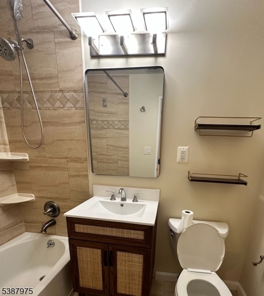 46 James Street, Unit 2 Newark, NJ 07102 - Photo 10 of 12 a bathroom with a sink mirror vanity and toilet