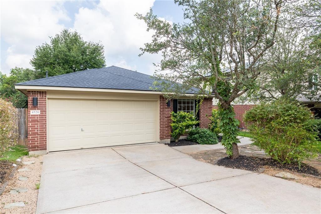4526 Corran Ferry Loop Austin, TX 78749 - Photo 3 of 25 Classic brick accents and a spacious concrete driveway define this charming front exterior.