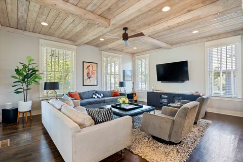 a living room with furniture and stairs