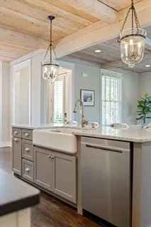 a view of a dining room with furniture wooden floor and chandelier