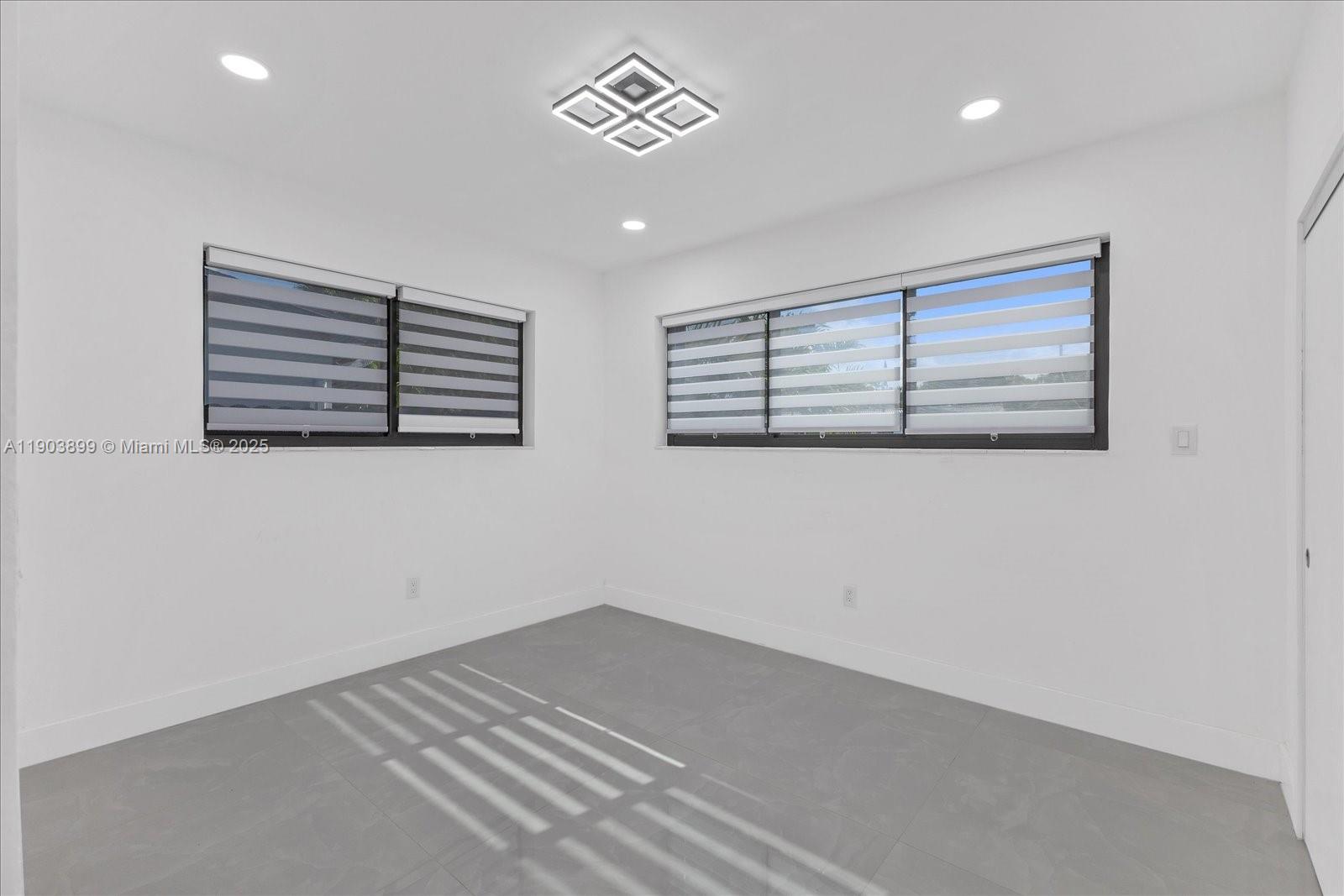 19511 Northeast 18th Place Miami, FL 33179 - Photo 18 of 38 an empty room with windows