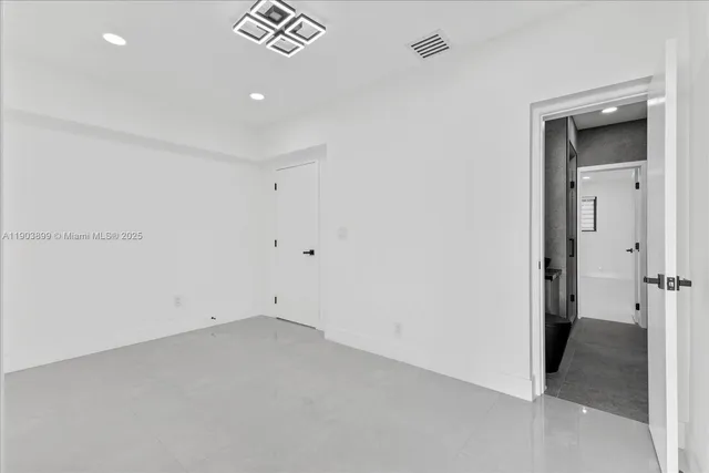 a large room with a lot of stainless steel appliances