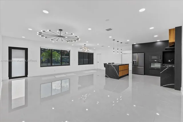 an aerial view of a tennis ground with a large pool