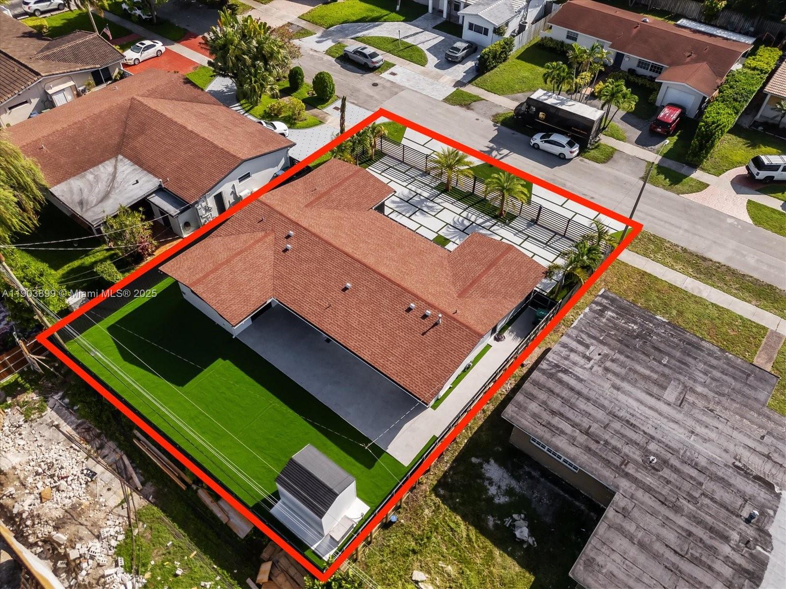 19511 Northeast 18th Place Miami, FL 33179 - Photo 37 of 38 an aerial view of a tennis ground with a large pool