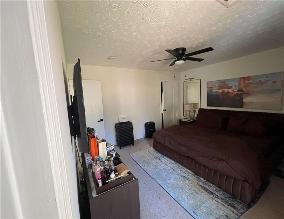 3915 Basil Way Southwest Atlanta, GA 30331 - Photo 20 of 21 a bed room with a bed window and a ceiling fan
