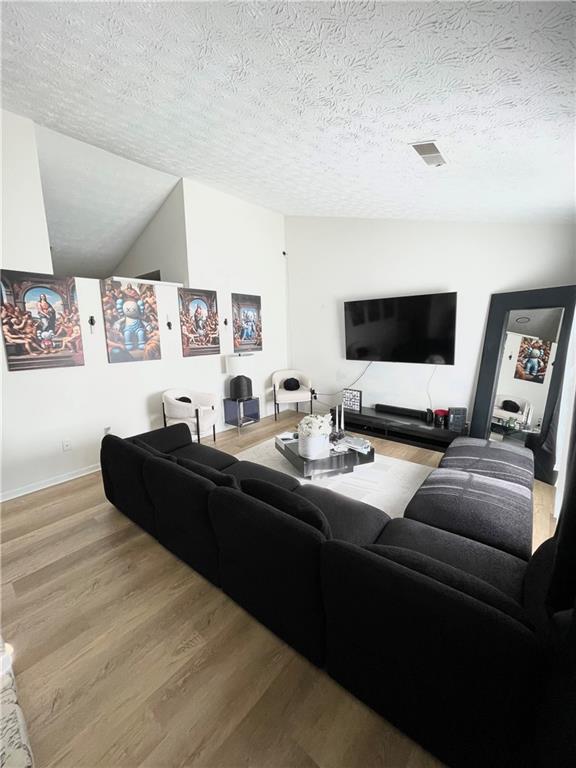 3915 Basil Way Southwest Atlanta, GA 30331 - Photo 4 of 21 a living room with furniture and a flat screen tv