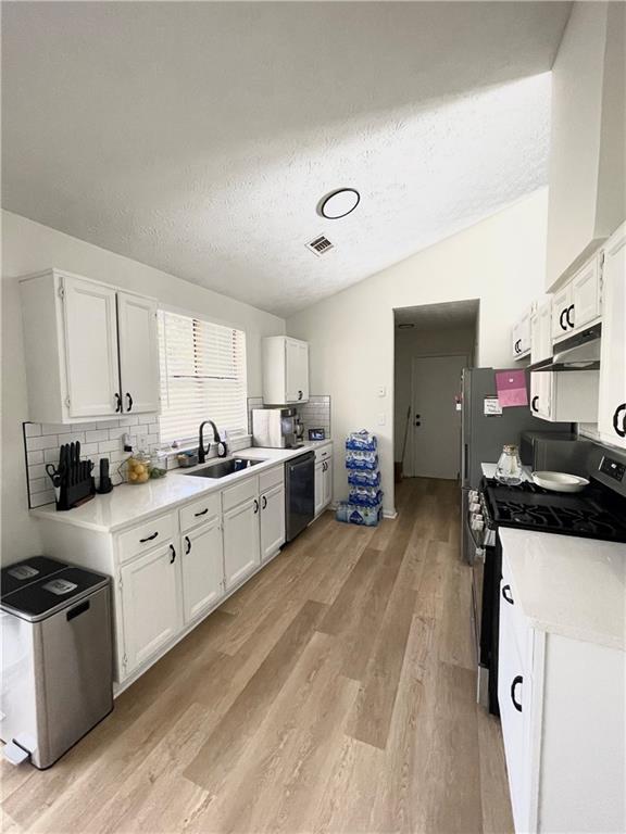 3915 Basil Way Southwest Atlanta, GA 30331 - Photo 6 of 21 a kitchen with a sink stove and cabinets
