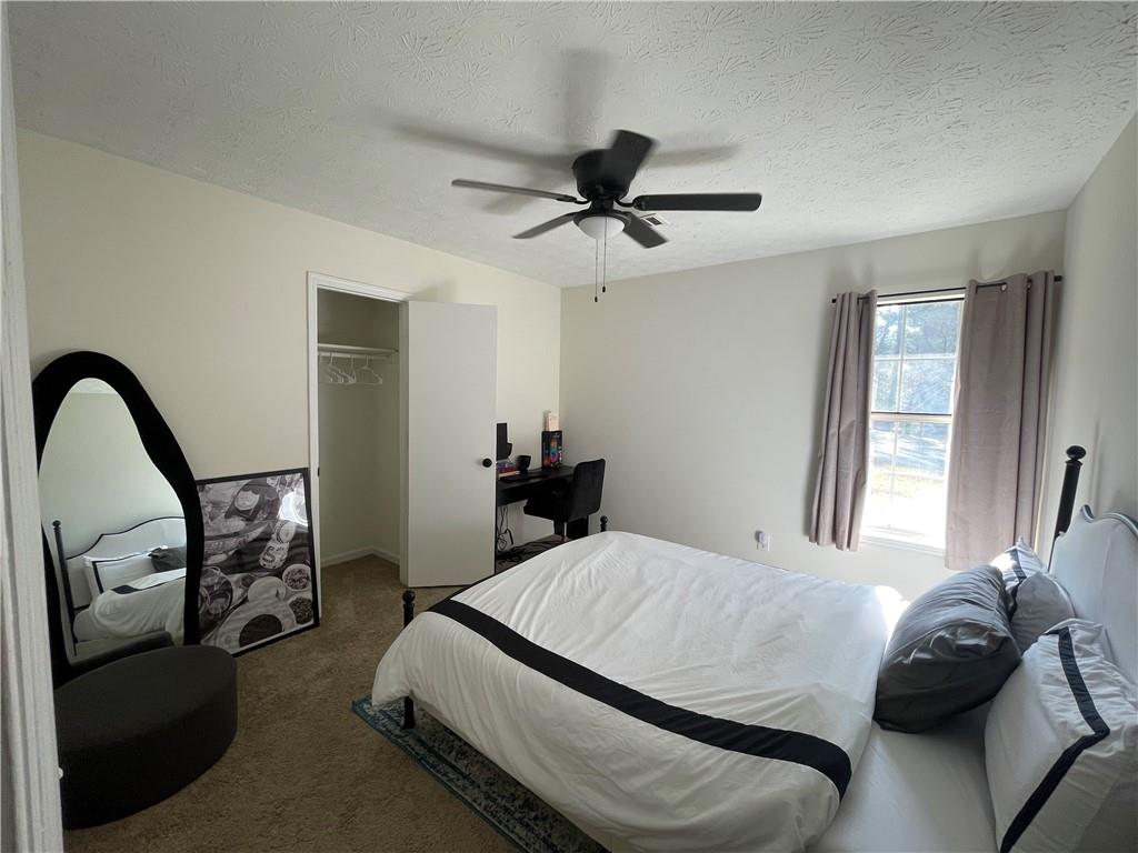 3915 Basil Way Southwest Atlanta, GA 30331 - Photo 9 of 21 a bedroom with a bed and a dresser