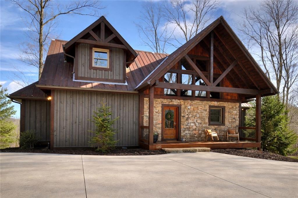 249 Settlement Road Epworth, GA 30541 - Photo 11 of 74 a front view of a house with garage