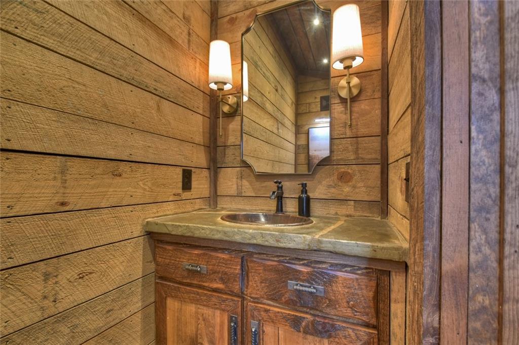 249 Settlement Road Epworth, GA 30541 - Photo 29 of 74 a bathroom with a sink and a mirror