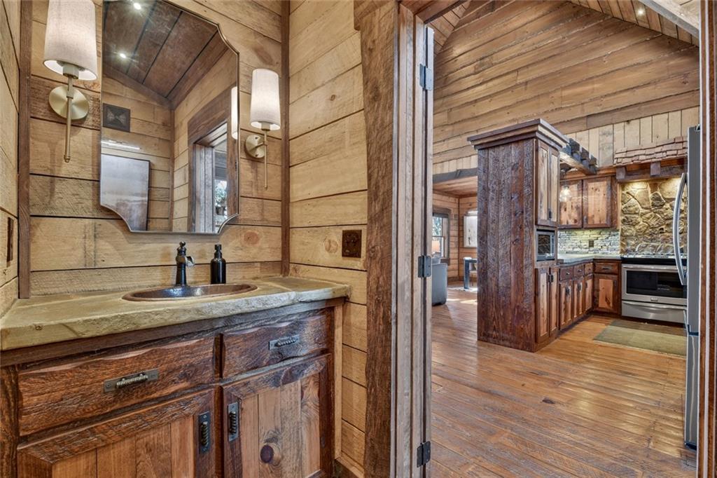 249 Settlement Road Epworth, GA 30541 - Photo 30 of 74 a kitchen with a sink and cabinets