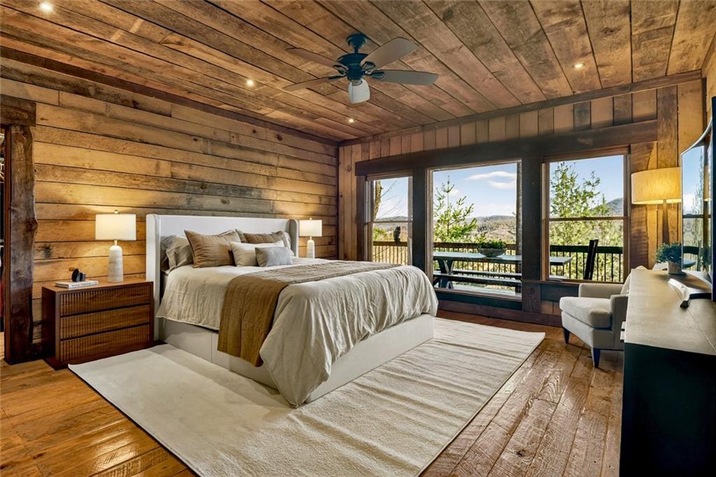 249 Settlement Road Epworth, GA 30541 - Photo 31 of 74 a bedroom with a large bed and a balcony