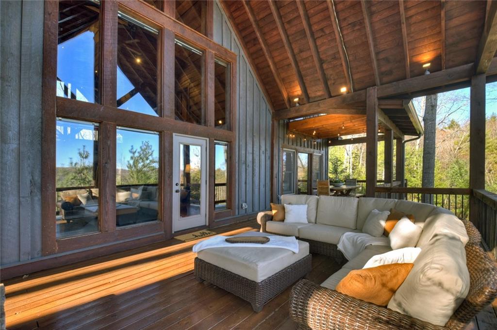 249 Settlement Road Epworth, GA 30541 - Photo 38 of 74 a living room with furniture and floor to ceiling windows