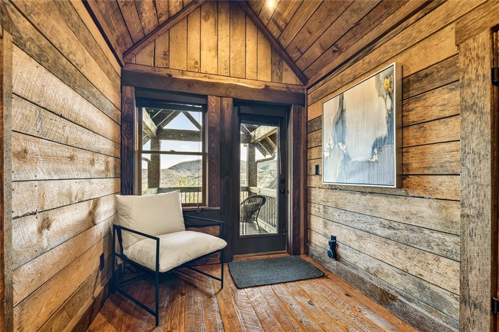 249 Settlement Road Epworth, GA 30541 - Photo 46 of 74 a view of a hallway with wooden floor and outdoor seating