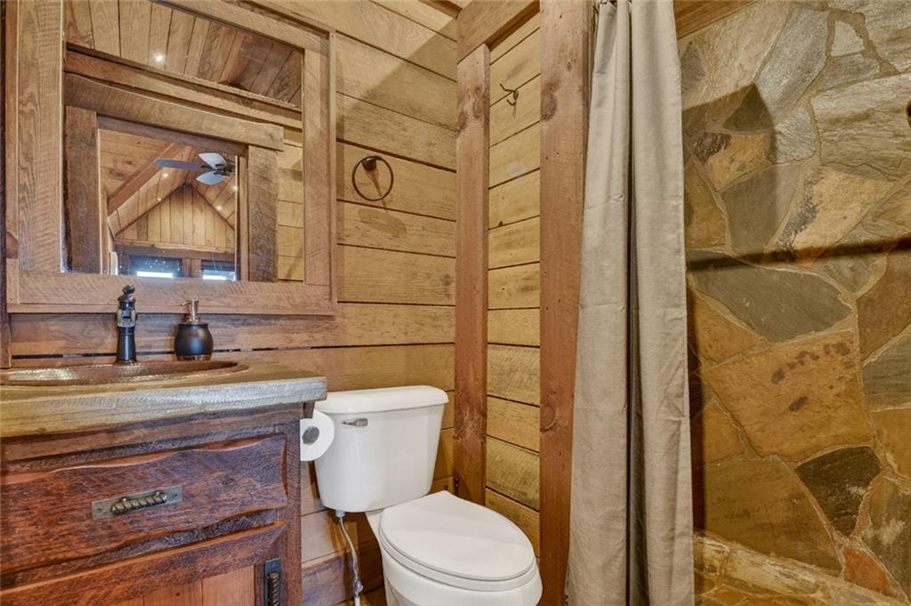 249 Settlement Road Epworth, GA 30541 - Photo 48 of 74 a white toilet sitting next to a bathroom sink