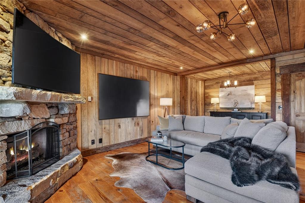 249 Settlement Road Epworth, GA 30541 - Photo 52 of 74 a living room with furniture and a flat screen tv